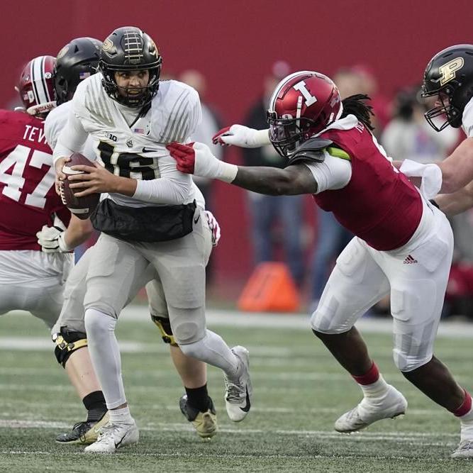 Purdue quarterback Aidan O Connell runs from Indiana.jpeg